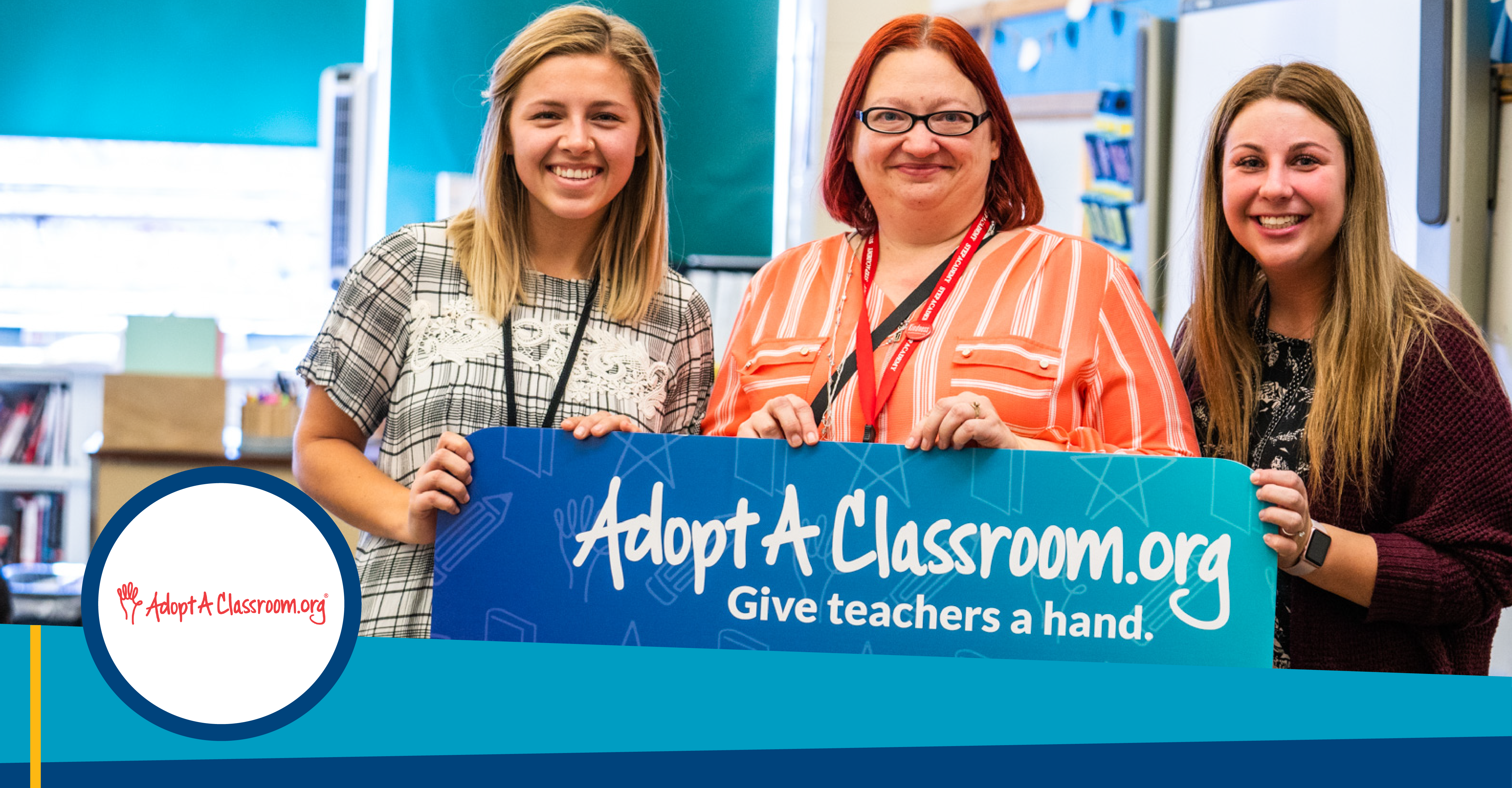 three women holding a sign that says "adoptaclassroom.org give teachers a hand"